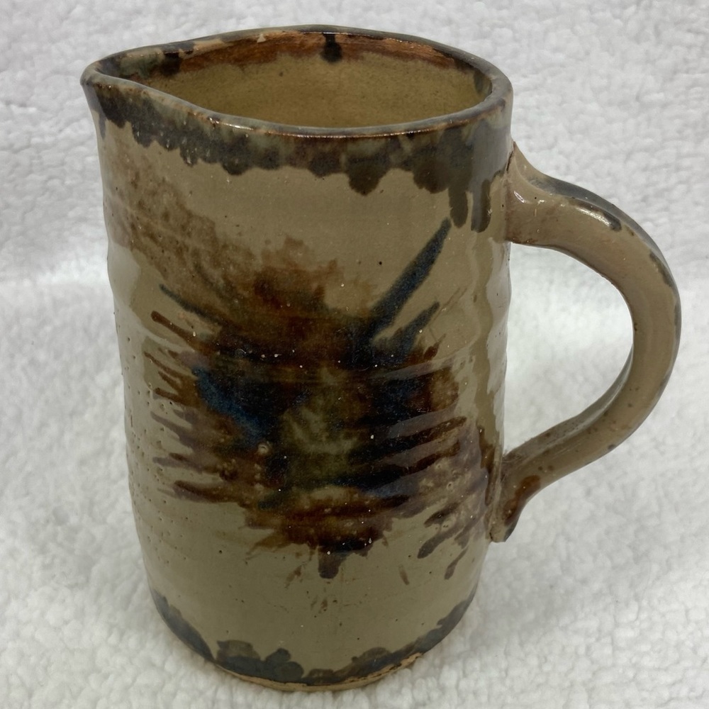 Art Pottery glazed earth tone pitcher signed